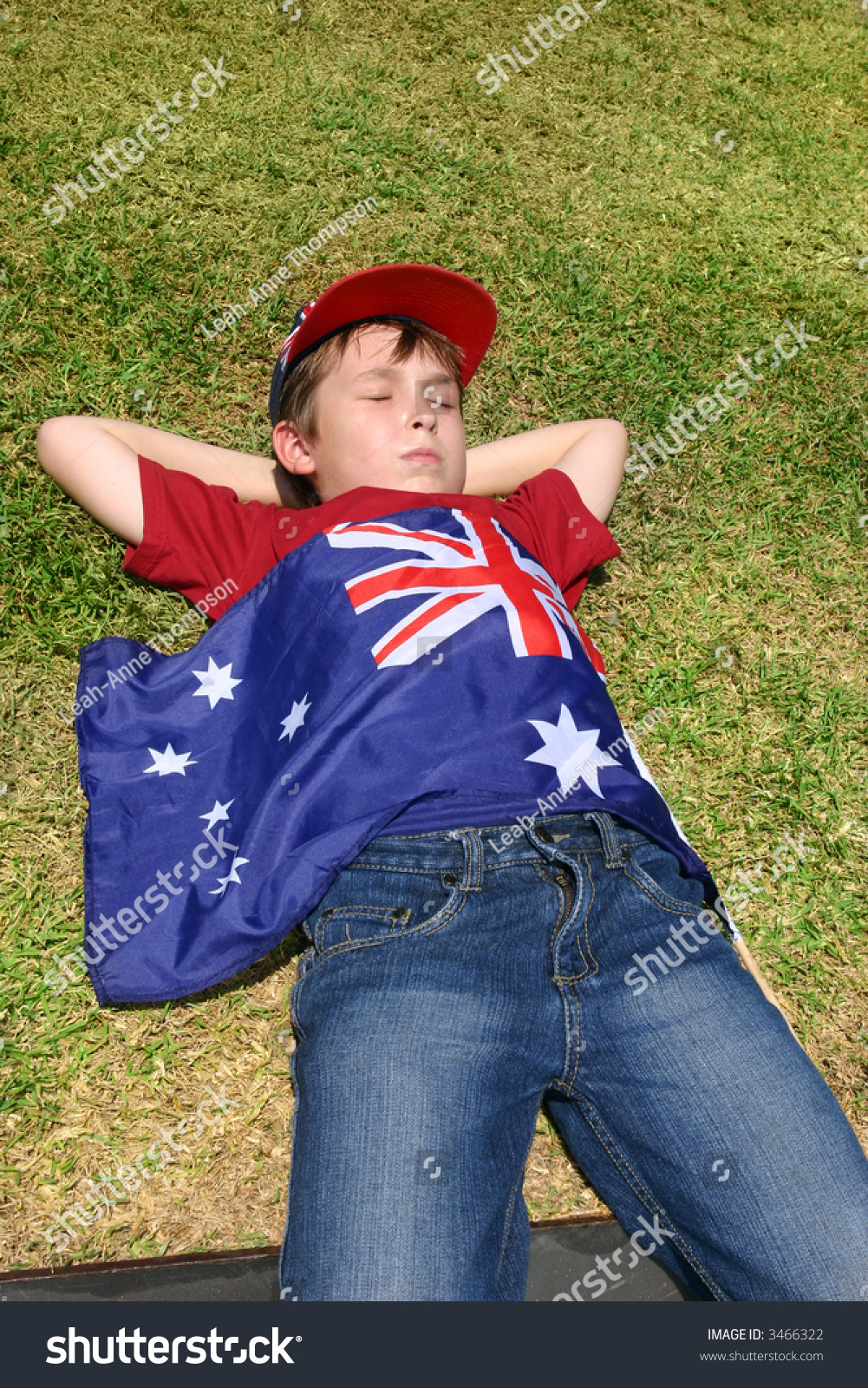 Patriotic Australian Boy With Australian Flag Taking A Short Rest On ...