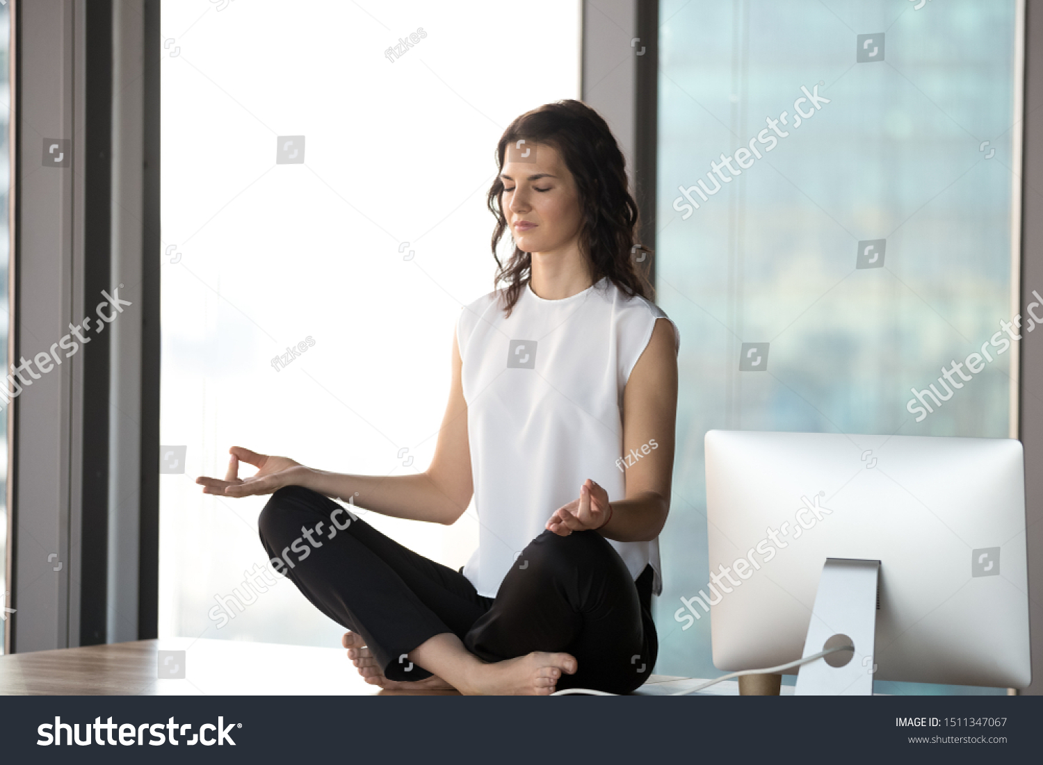 Peaceful Businesswoman Meditating On Desk Modern Stock Photo Edit