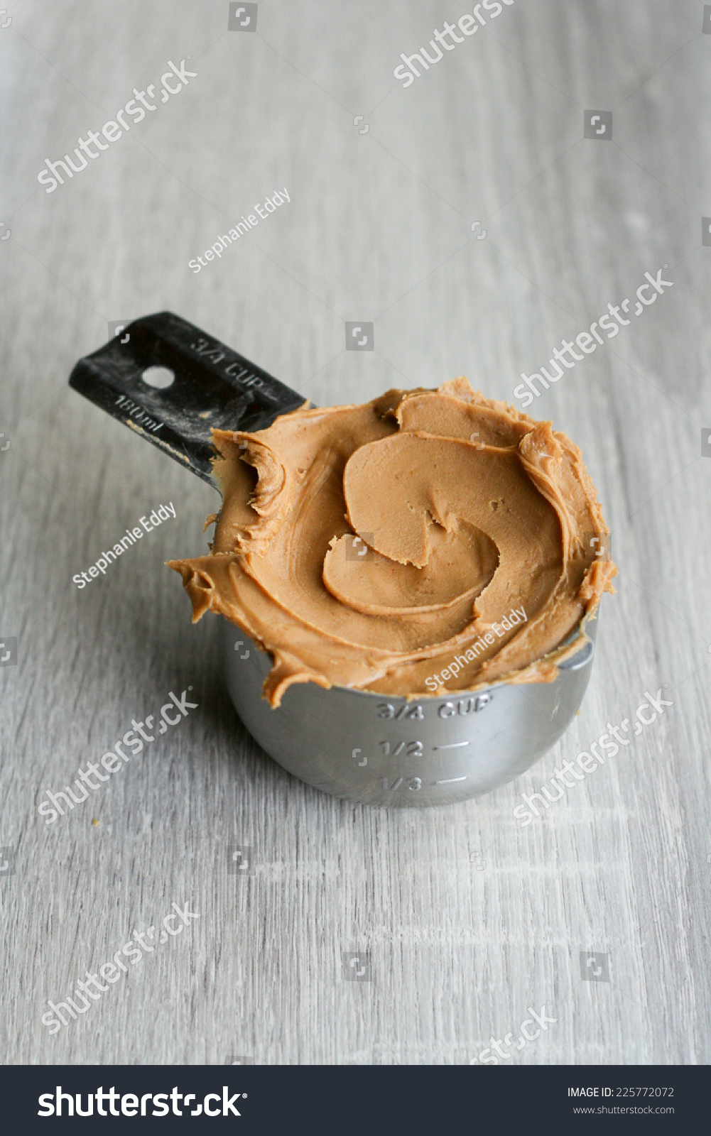 Peanut Butter Measuring Cup On Grey Stock Photo Edit Now 225772072