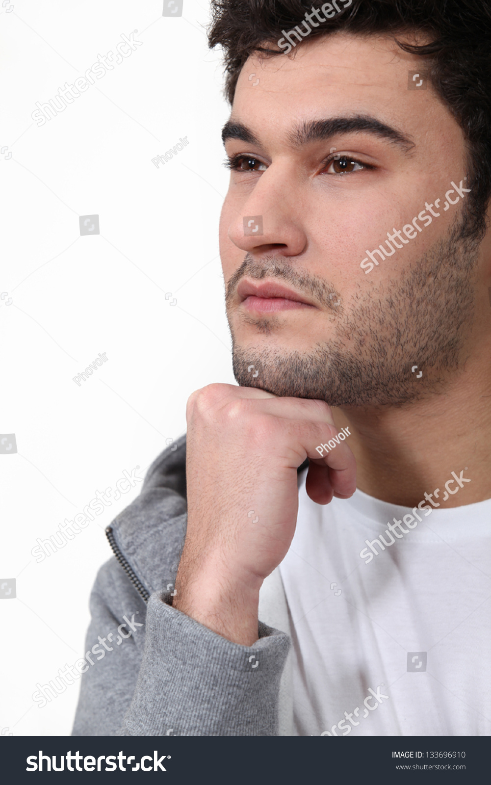 Pensive Man Stood Touching Chin With Fist Stock Photo 133696910 ...