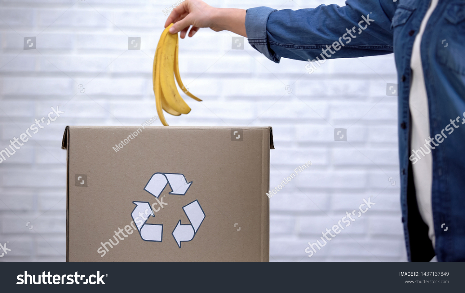 Person Throwing Banana Peel Into Trash Stock Photo 1437137849   Stock Photo Person Throwing Banana Peel Into Trash Bin Organic Waste Sorting Awareness 1437137849 