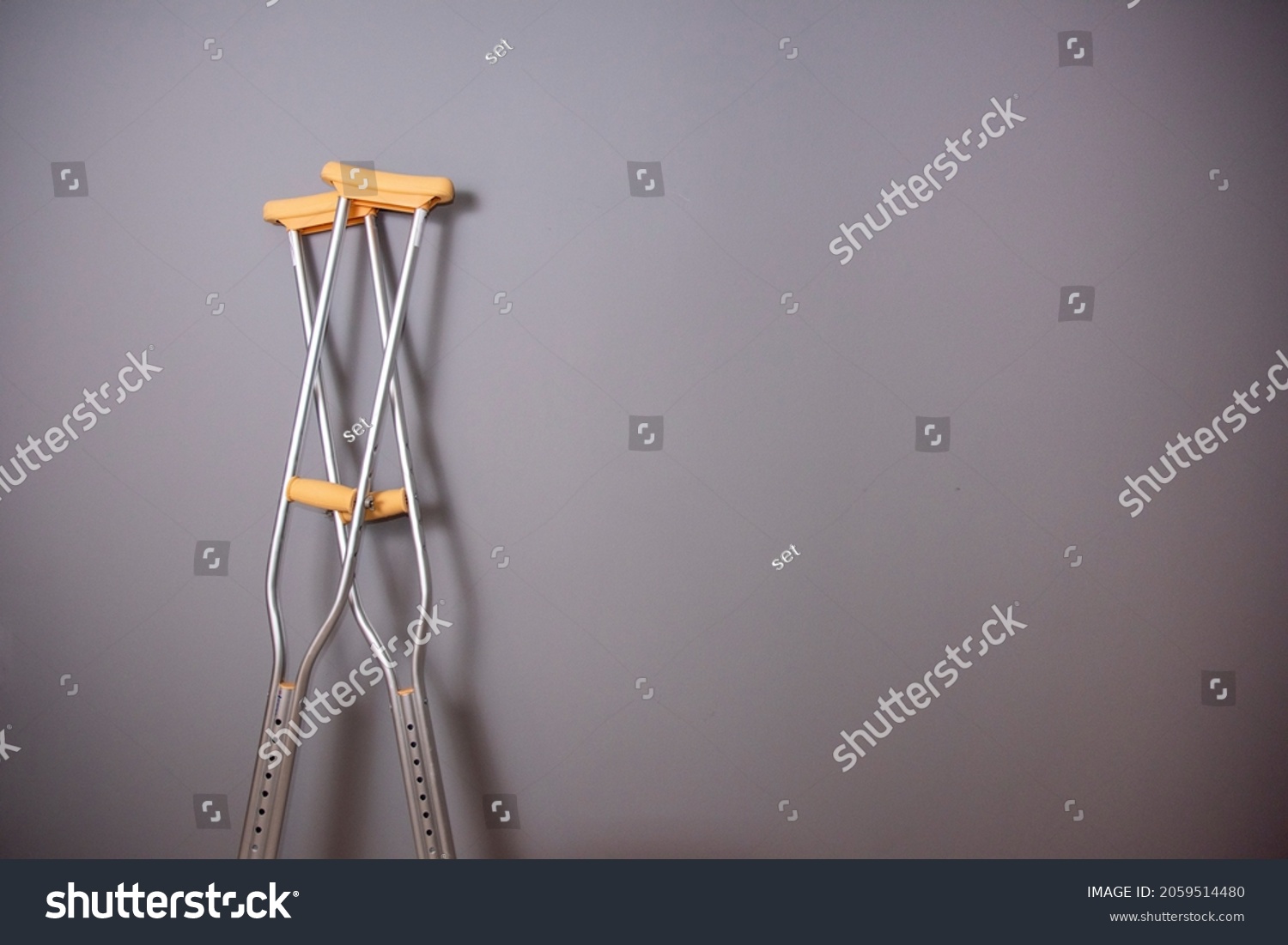 Photo Crutches On Gray Background Stock Photo 2059514480 | Shutterstock