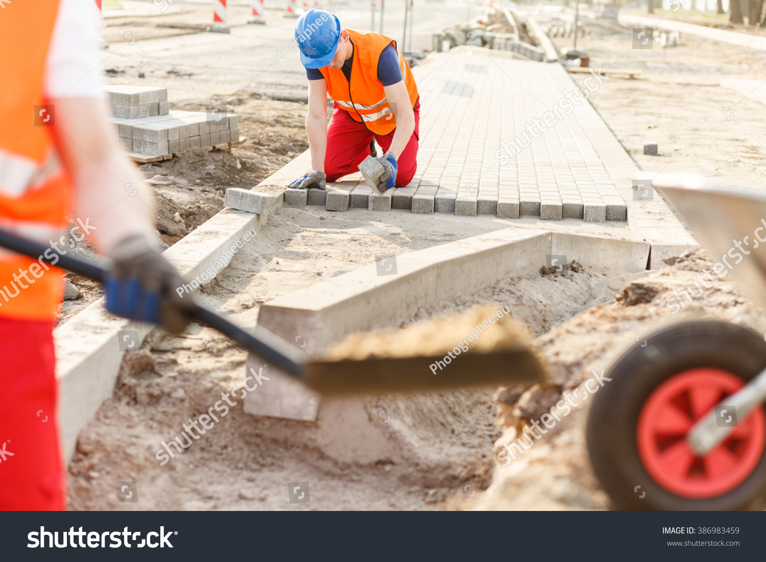 Photo Of Young Construction Worker Laying New Cobblestones - 386983459 ...