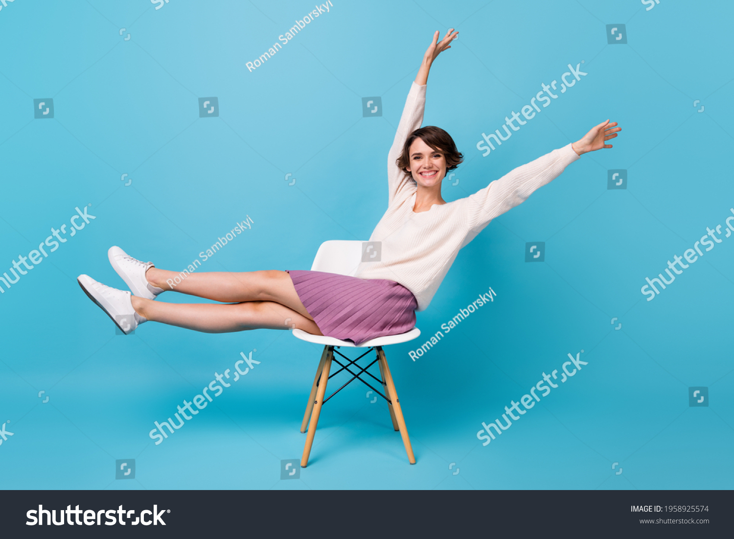 1 Photo Portrait Full Body Side Profile View Of Excited Girl Lifting Legs Arms Up Sitting On