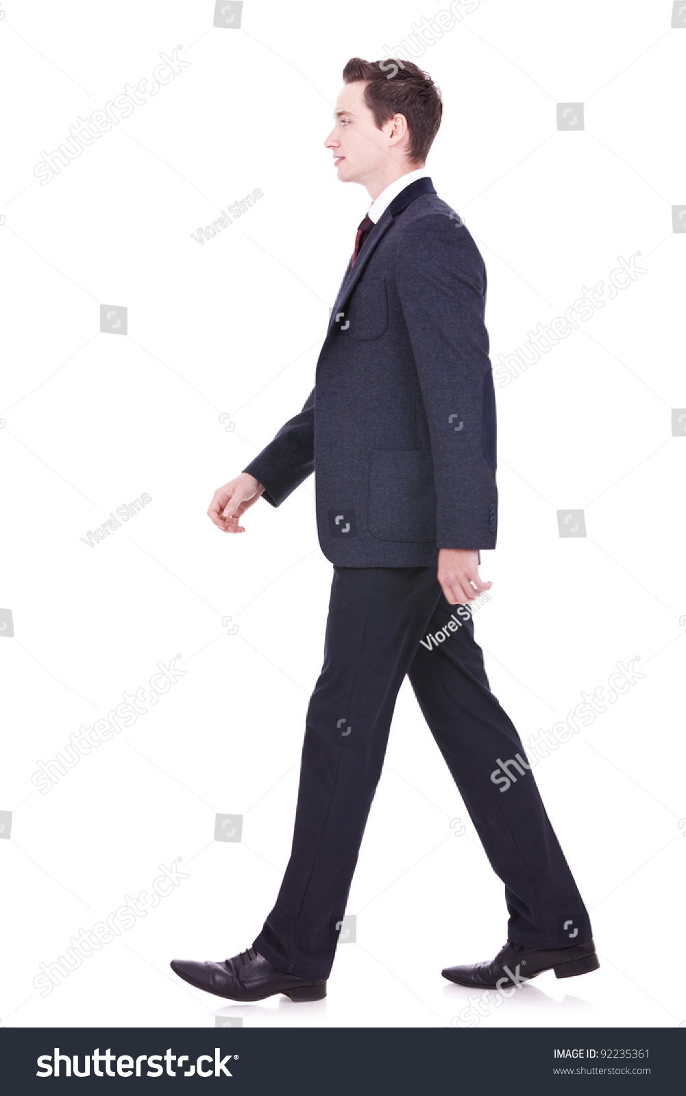 stock-photo-picture-of-a-young-business-man-walking-forward-side-view-92235361.jpg