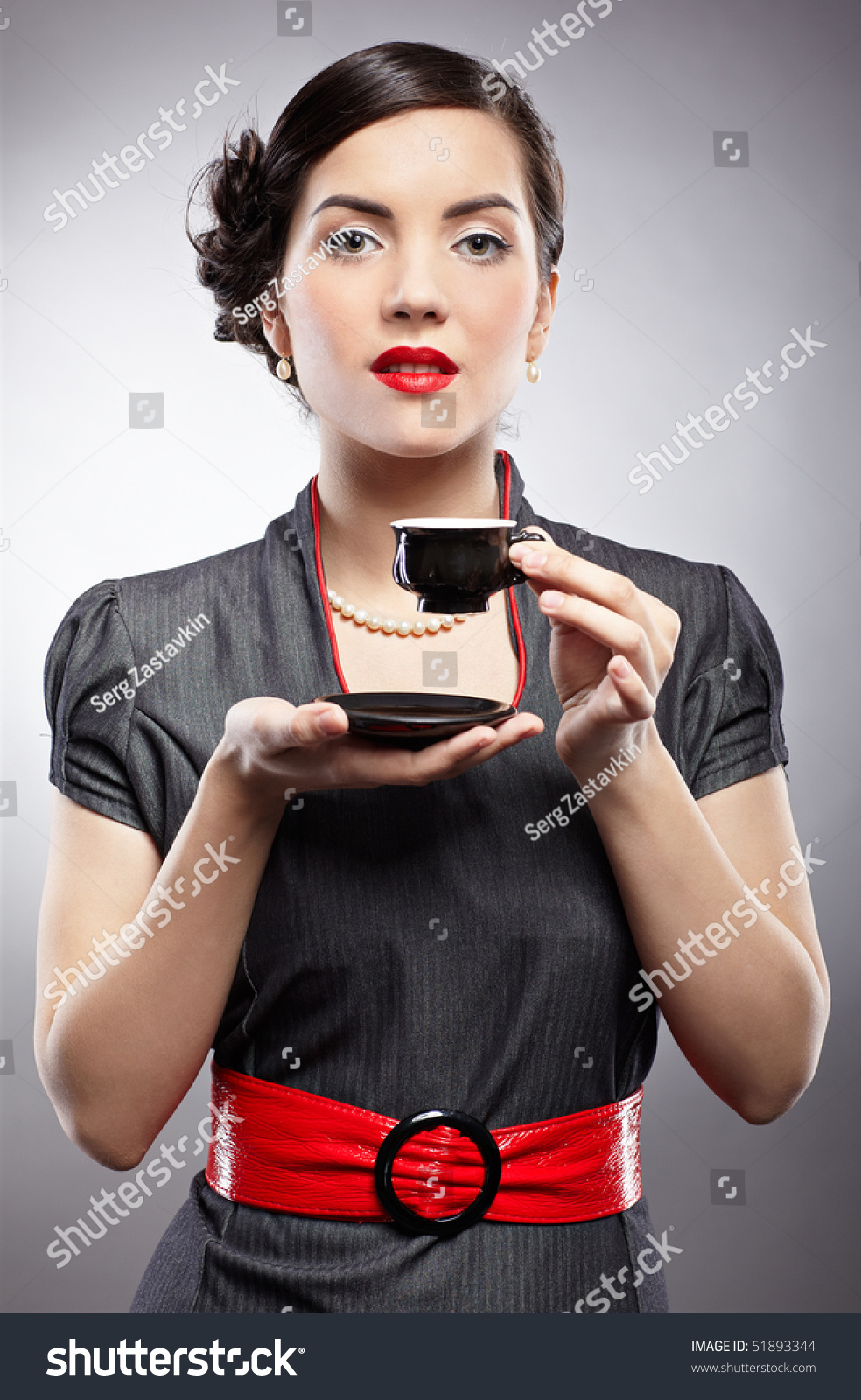 Pin-Up Style Portrait Of Beautiful Brunette Girl Posing On Gray Stock ...