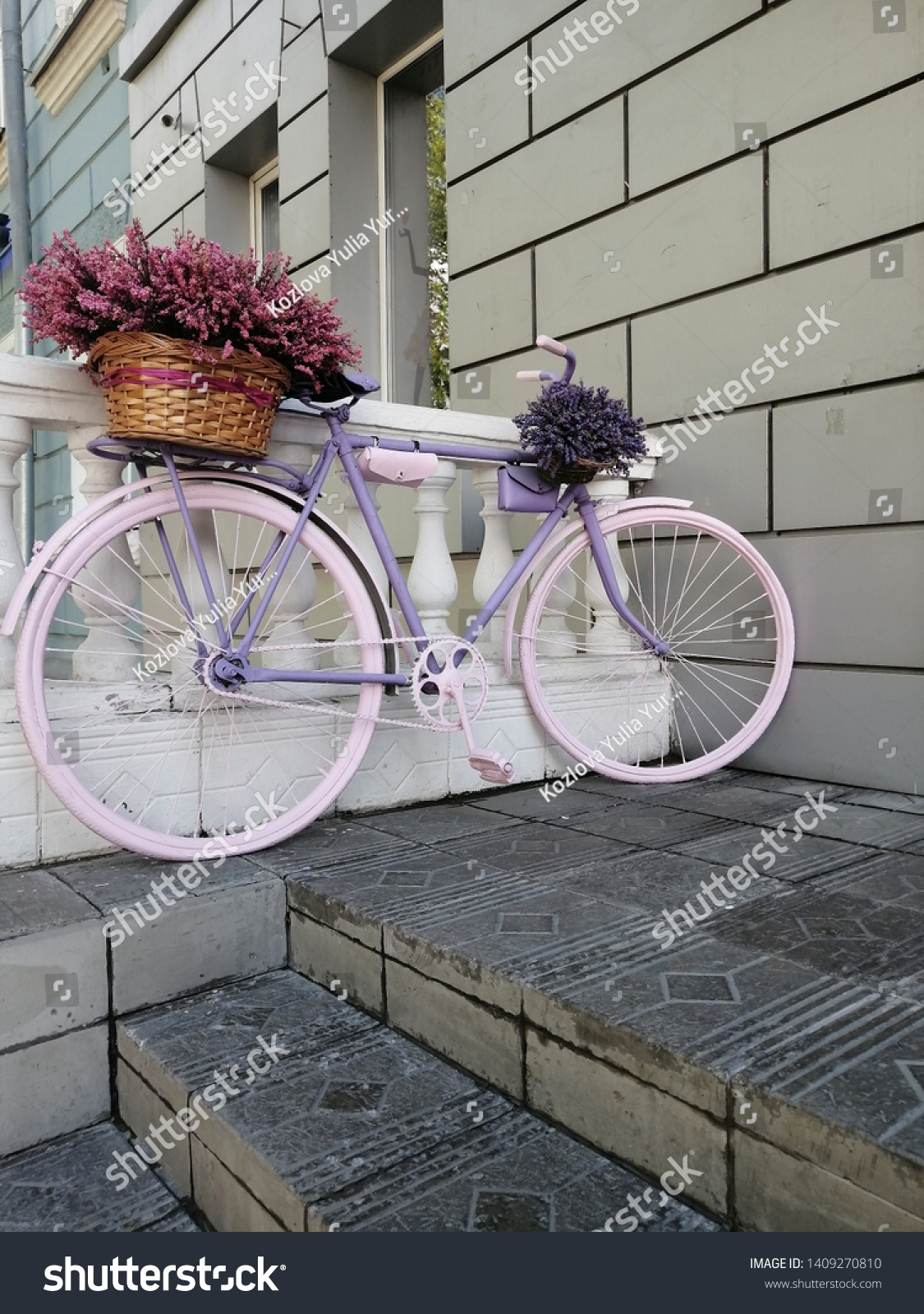 purple bike with basket