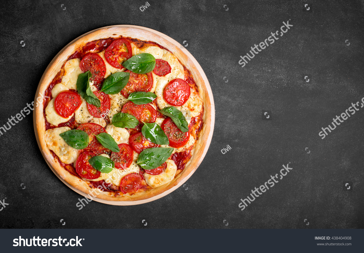 Pizza (margherita) on the chalk board with copy space
