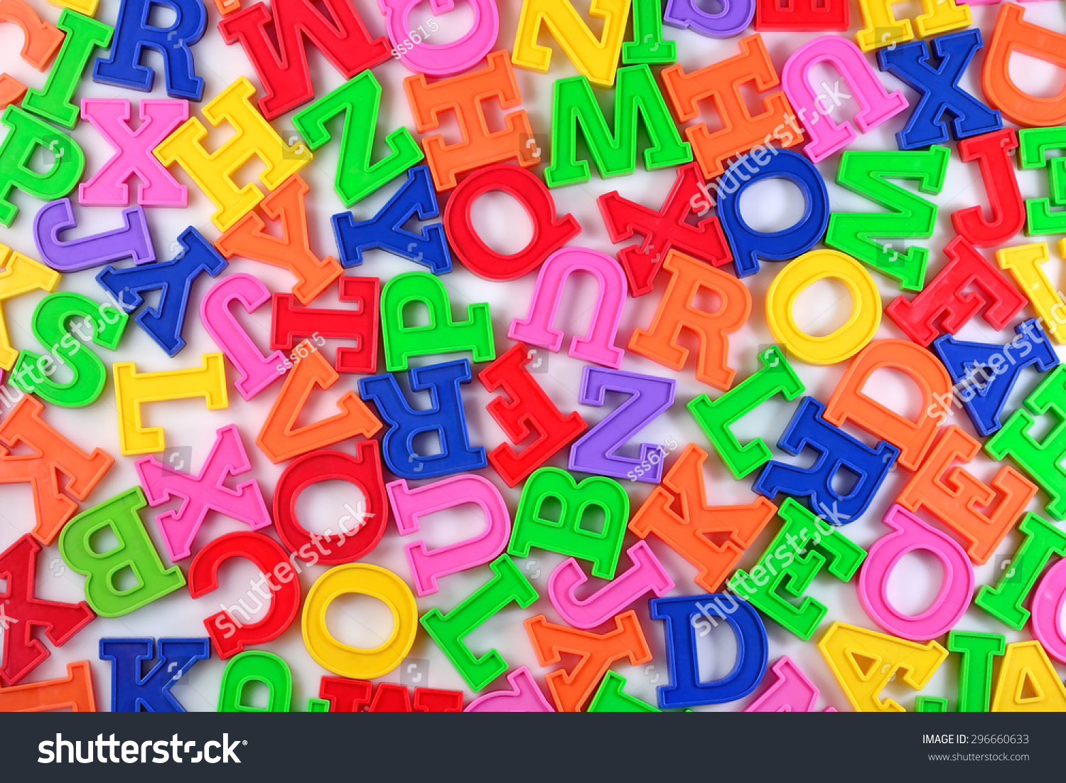 plastic-colorful-alphabet-letters-on-white-stock-photo-296660633