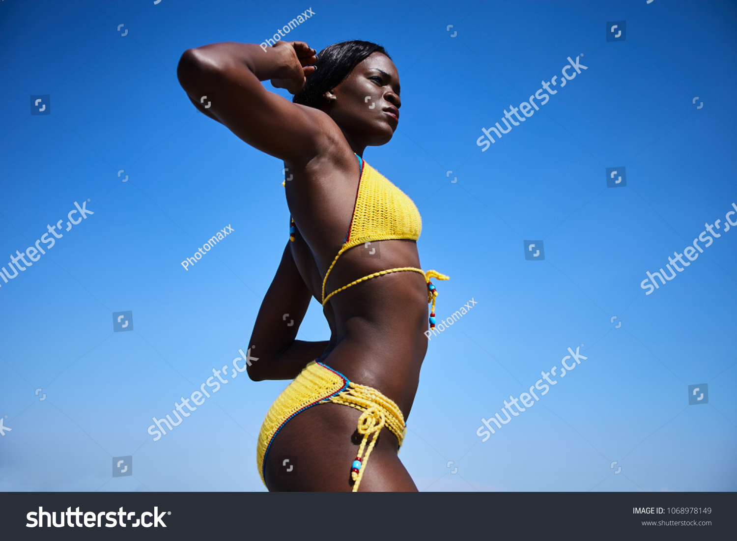 yellow swimsuit on dark skin