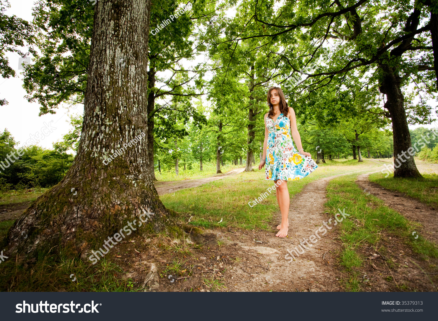 Portrait Of A Barefoot Woman Walking Alone In The Forest Stock Photo ...