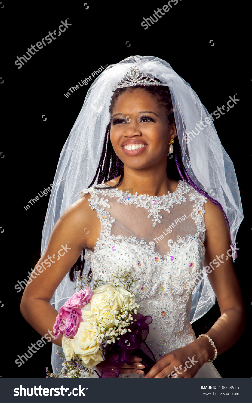 https://image.shutterstock.com/z/stock-photo-portrait-of-a-beautiful-african-american-bride-on-her-wedding-day-black-background-with-a-back-408358975.jpg