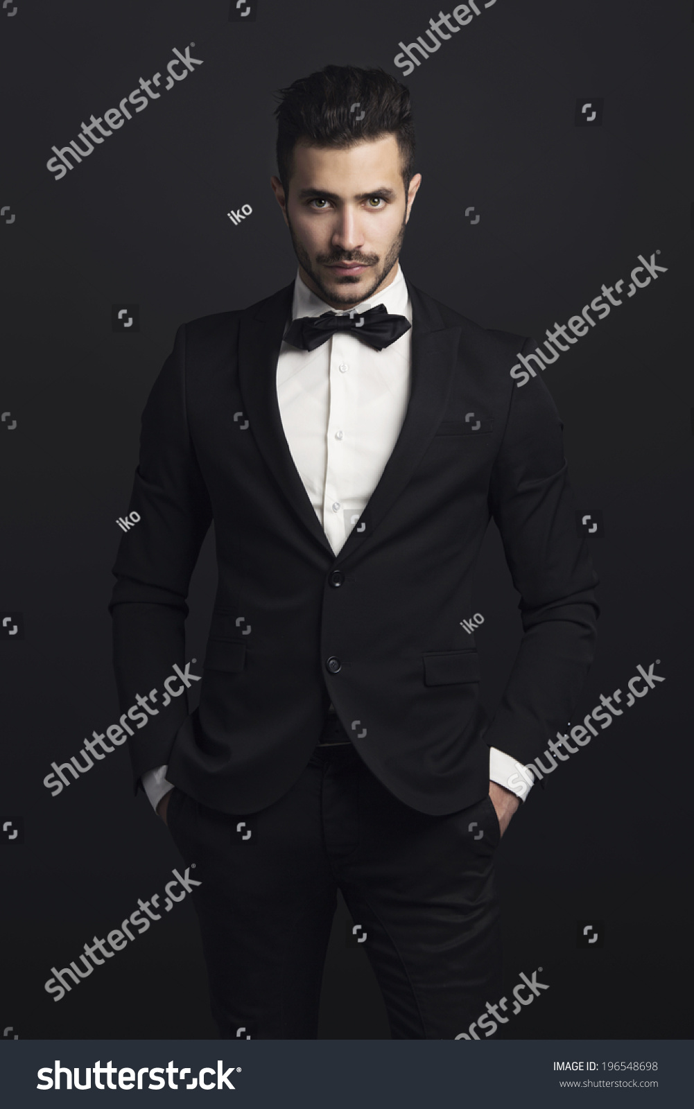 Portrait Of A Beautiful Latin Man Smiling Wearing A Tuxedo Stock Photo ...