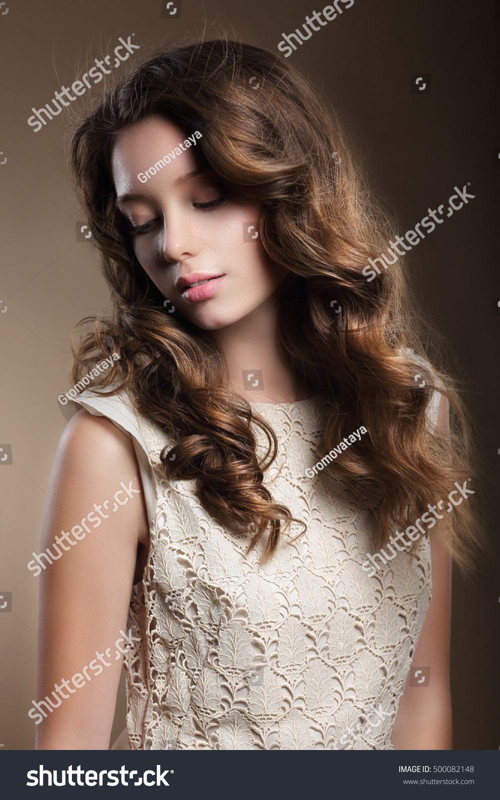 Portrait of a beautiful woman with long curly hairs Portrait of a beautiful woman with long curly hairs