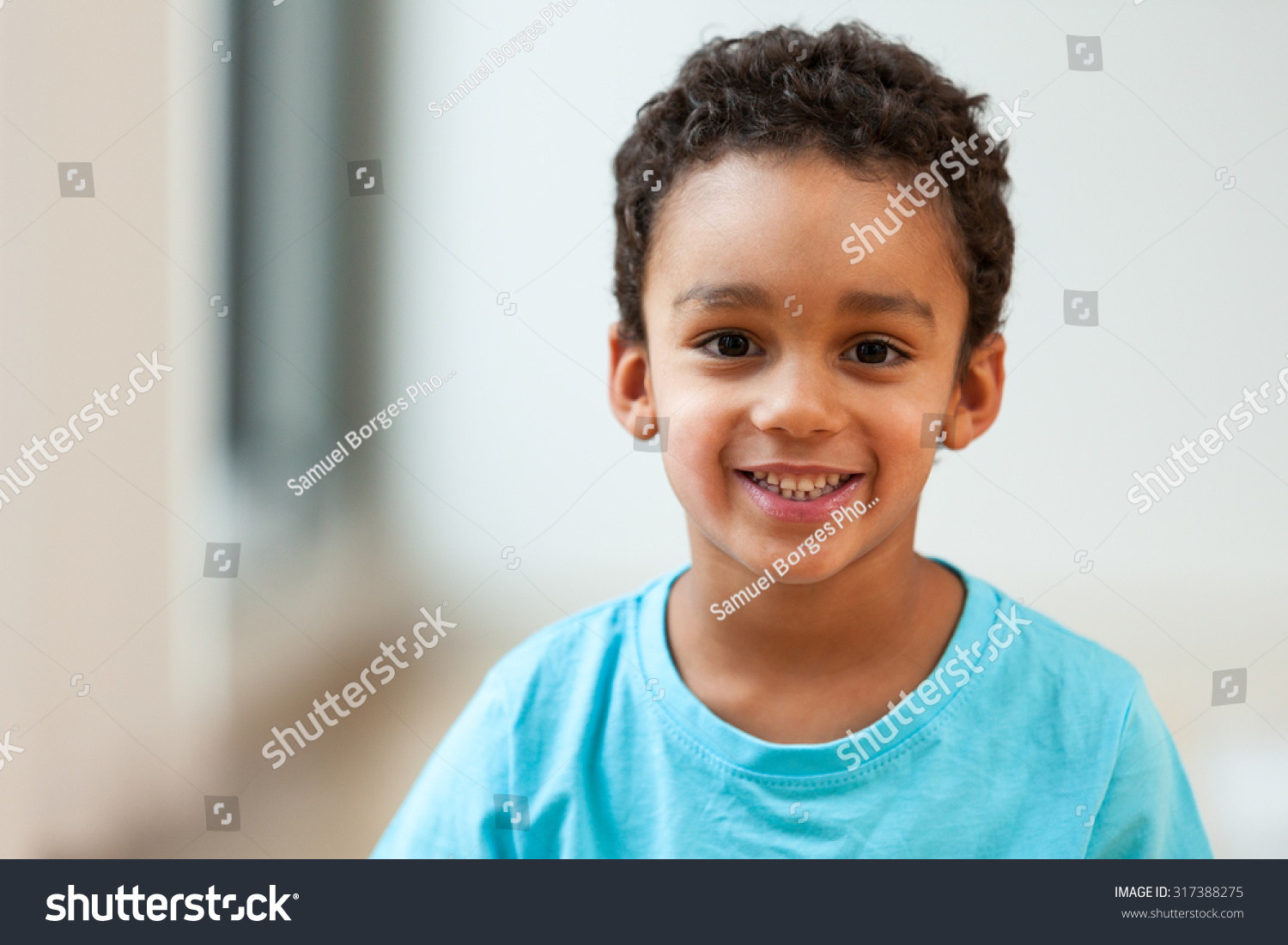 Portrait Of A Cute Little African American Boy Smiling Stock Photo ...