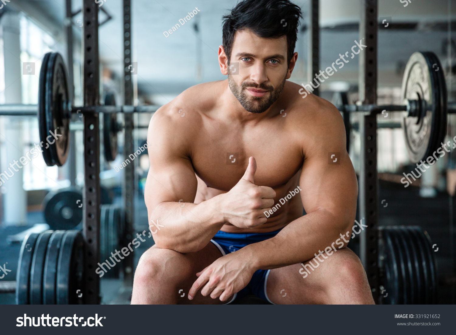 Portrait Handsome Male Bodybuilder Sitting On Stock Photo