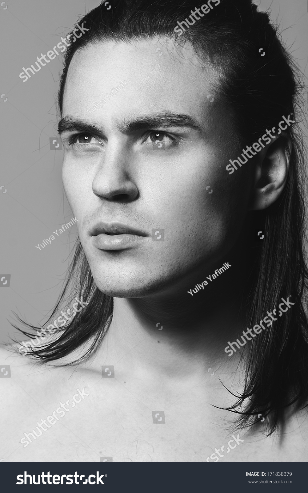 Portrait of a handsome man in studio black and white photographs close up