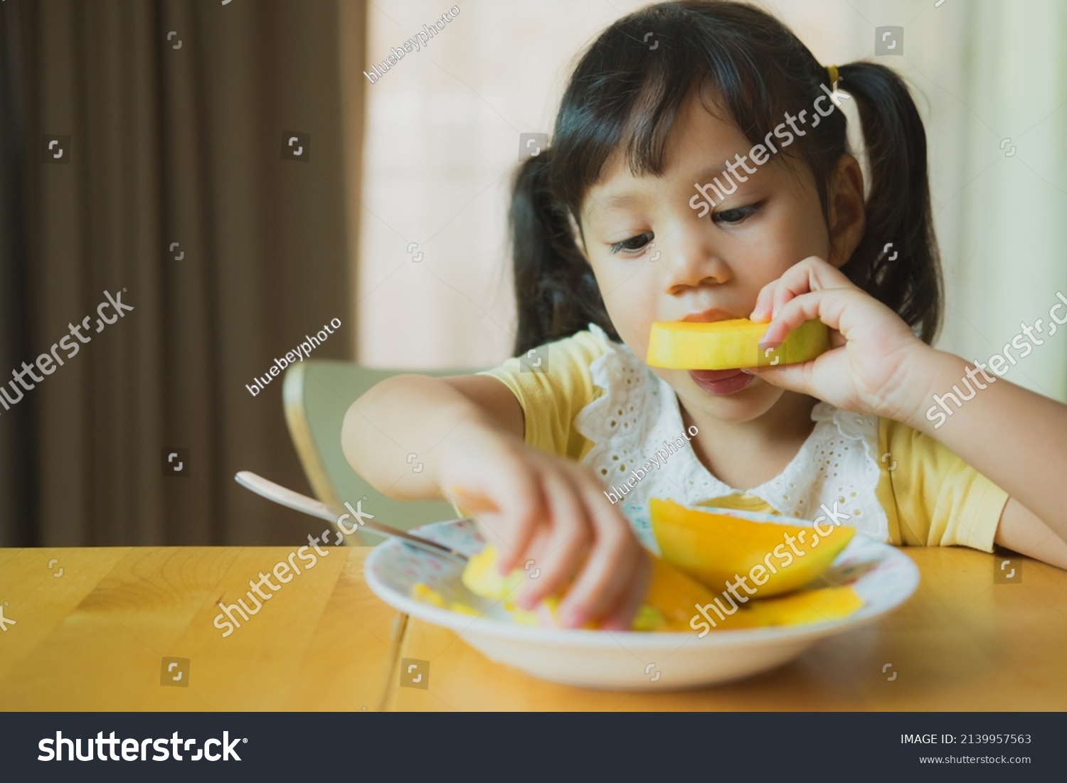 Portrait Happy Little Girl Eating Mango Stock Photo 2139957563 ...