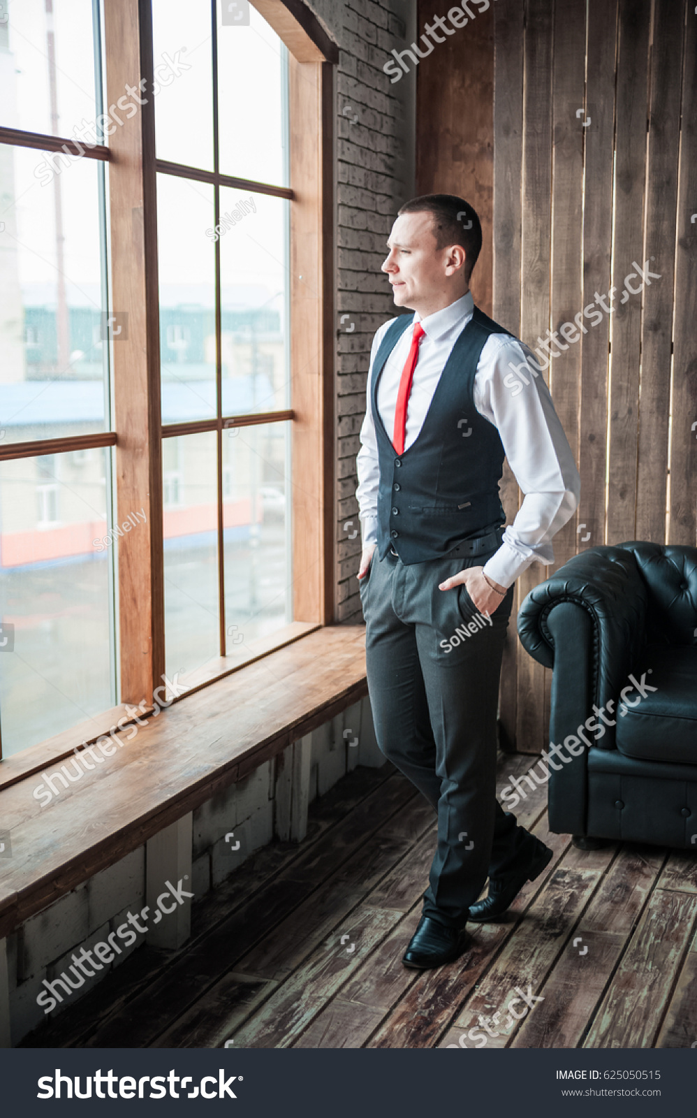 black vest white shirt red tie