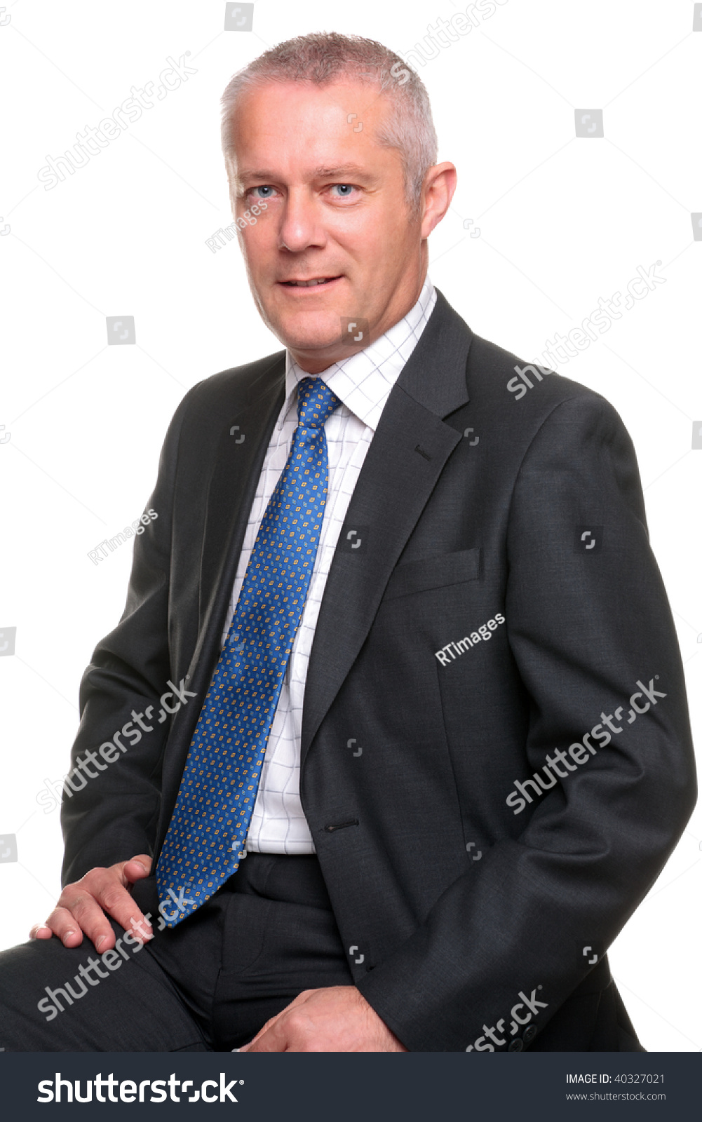 Portrait Of A Mature Businessman Wearing A Gray Suit With Blue Tie ...