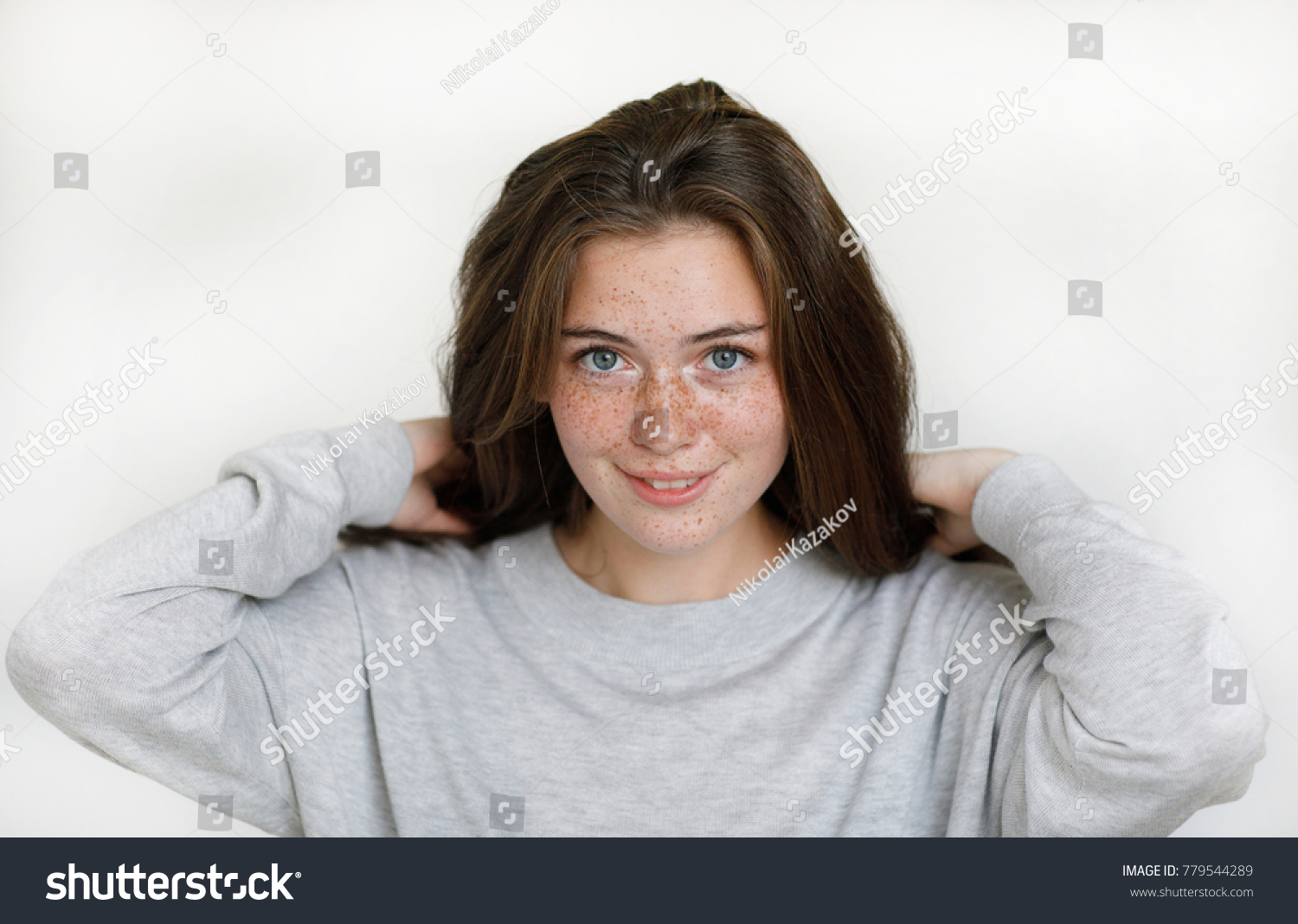 Portrait Of A Positive And Kind Girl With A Smile On Her Freckled Face Dropping Her Portrait Of A Positive And Kind Girl With A Smile On Her Freckled Face Dropping Her