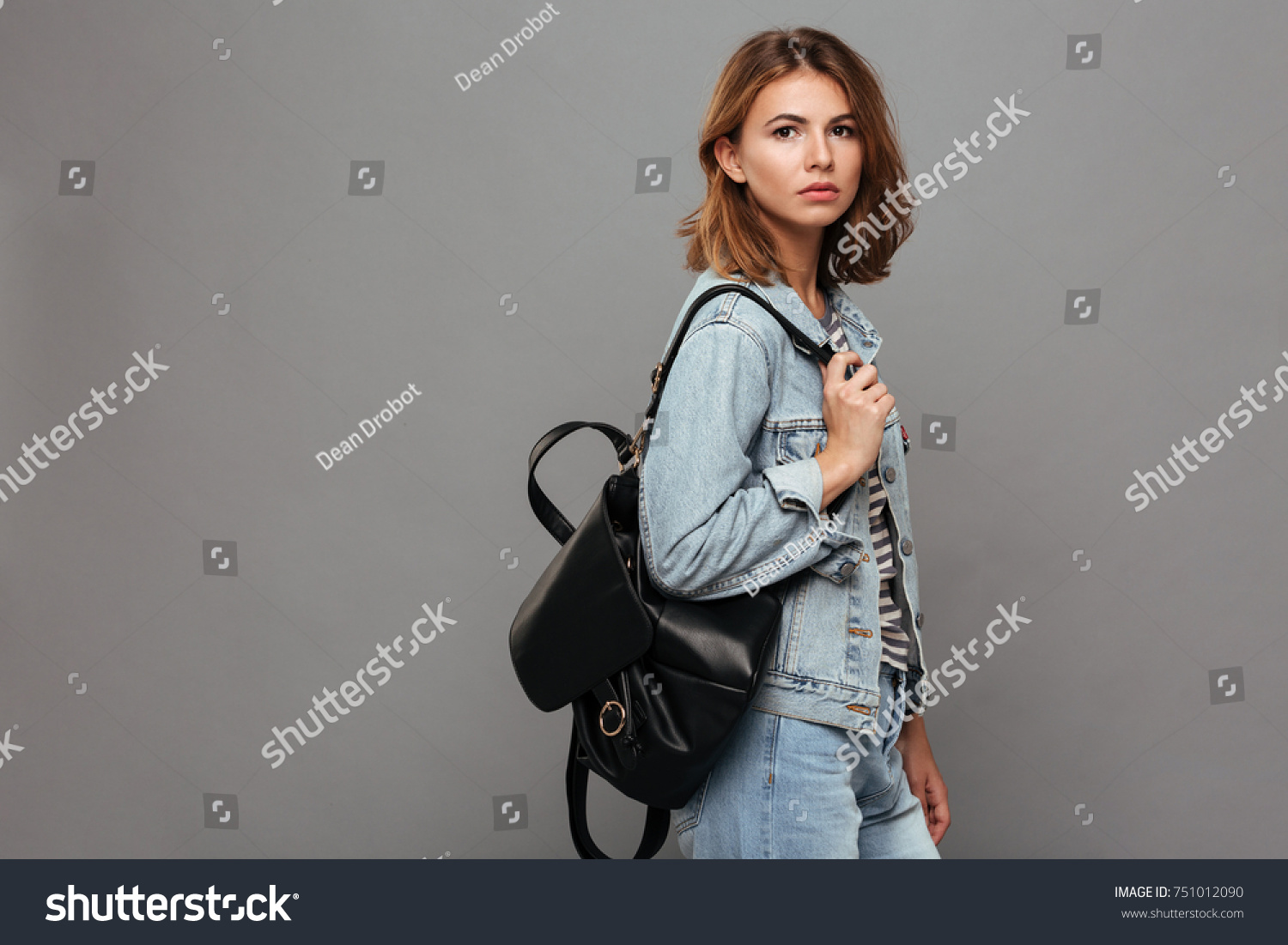 girl holding backpack