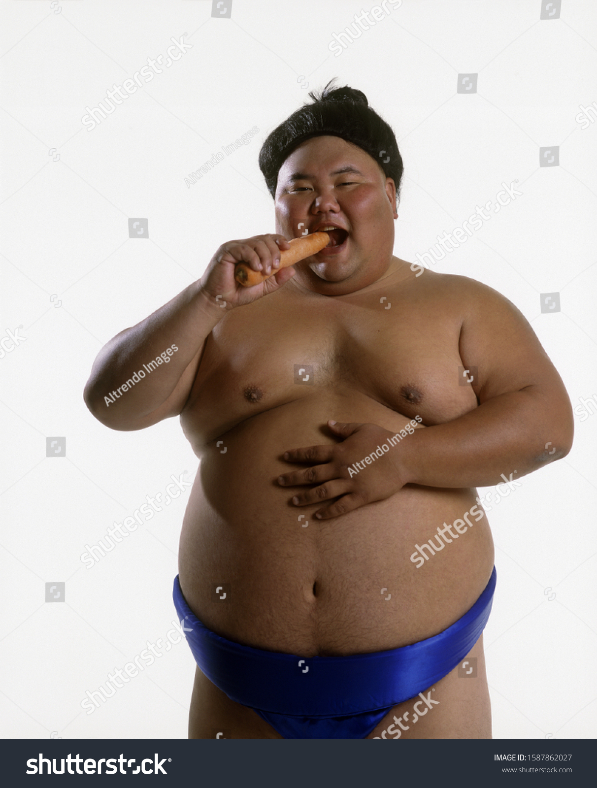 Portrait Sumo Wrestler Eating Carrot Stock Photo Edit Now