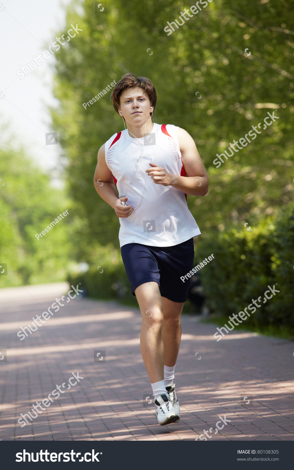 Portrait Of A Young Man Jogging With A Walkman In Park Stock Photo ...