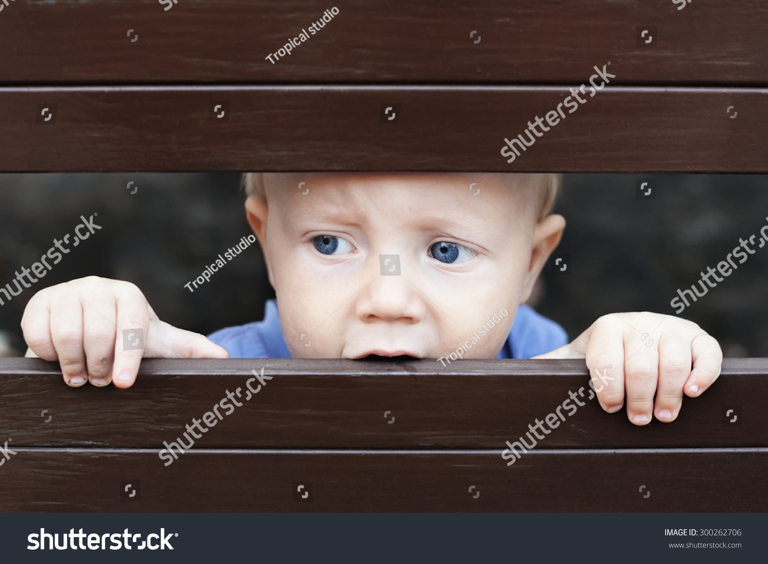 Portrait Of Abandoned By Parents Little Baby Boy With Staring Blue Eyes ...