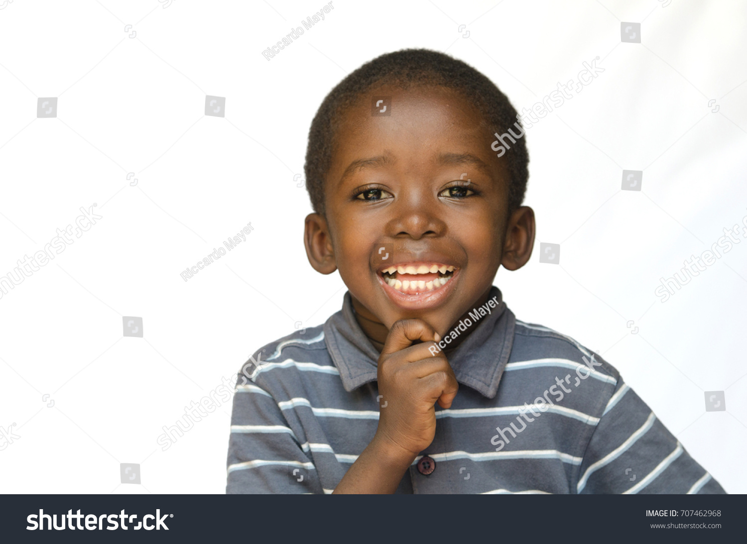 Portrait of african black boy child smiling with toothy smile isolated on white