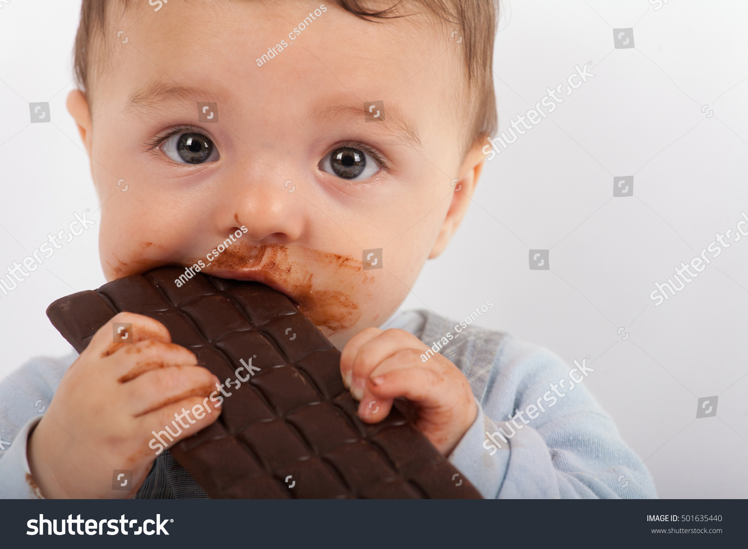 Portrait Of An Adorable Baby Eating Chocolate Stock Photo 501635440 ...