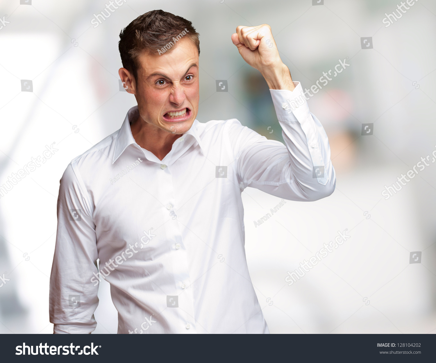 Portrait Angry Young Man Clenching His Stock Photo Edit Now 128104202