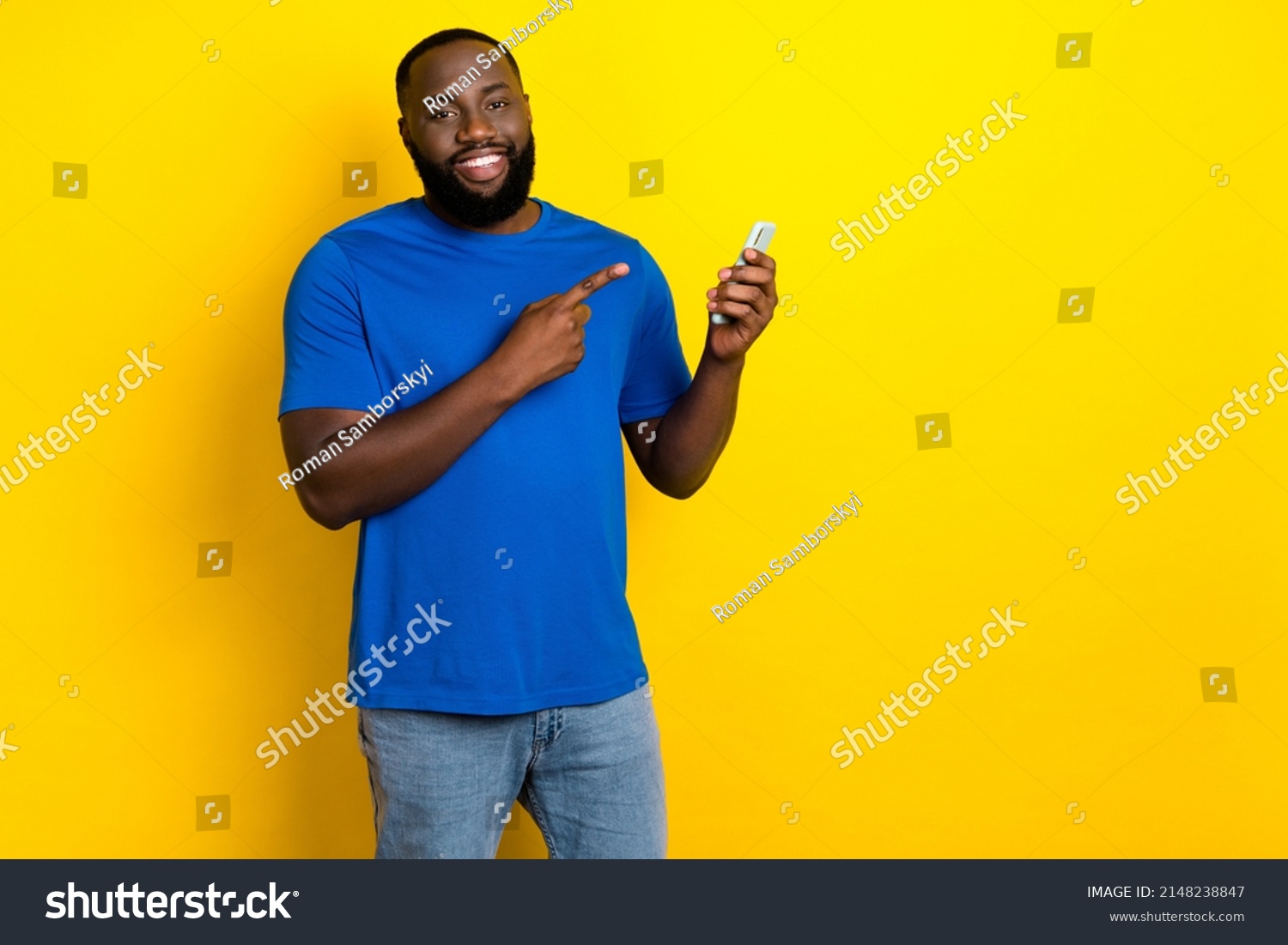 portrait-attractive-cheerful-guy-using-demonstrating-stock-photo