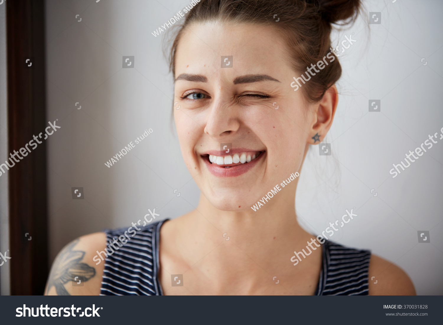 Portrait Of Attractive Cute Woman Winking Over Gray Background. Looking ...