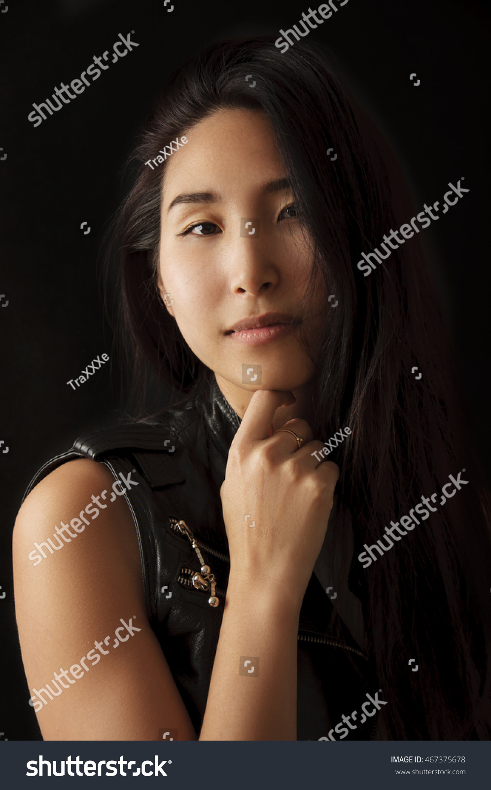 https://image.shutterstock.com/z/stock-photo-portrait-of-beautiful-mongolian-woman-with-serious-look-on-black-background-467375678.jpg