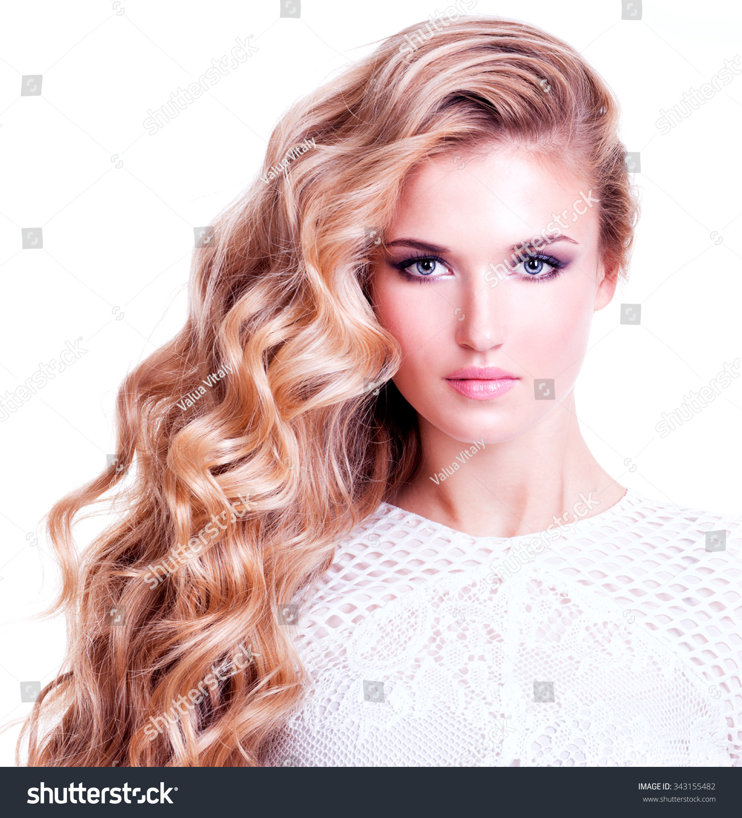 Portrait of a beautiful woman with long curly hairs Portrait of a beautiful woman with long curly hairs