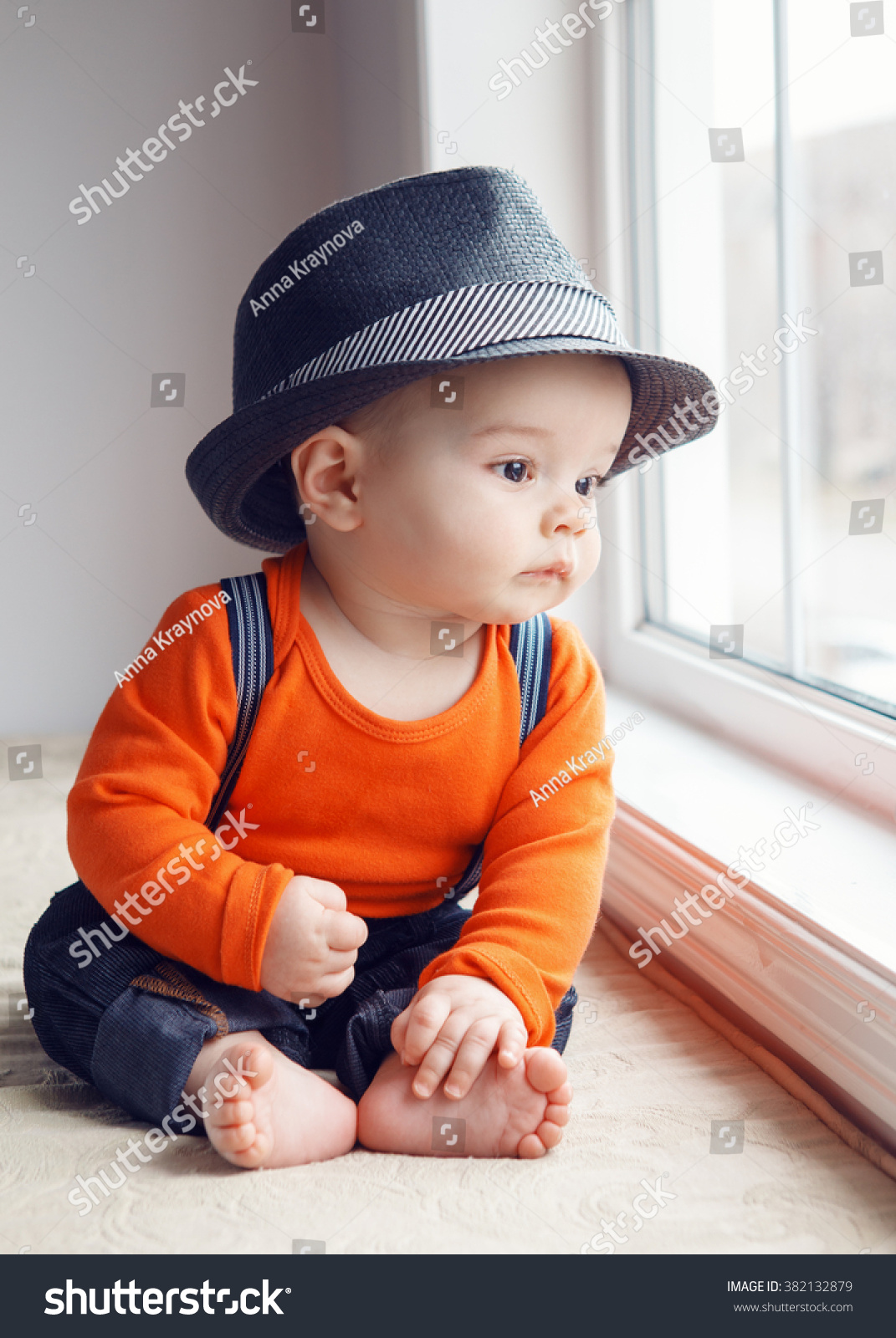 Portrait Of Cute Adorable Stylish Caucasian Baby Boy With Black Eyes In ...