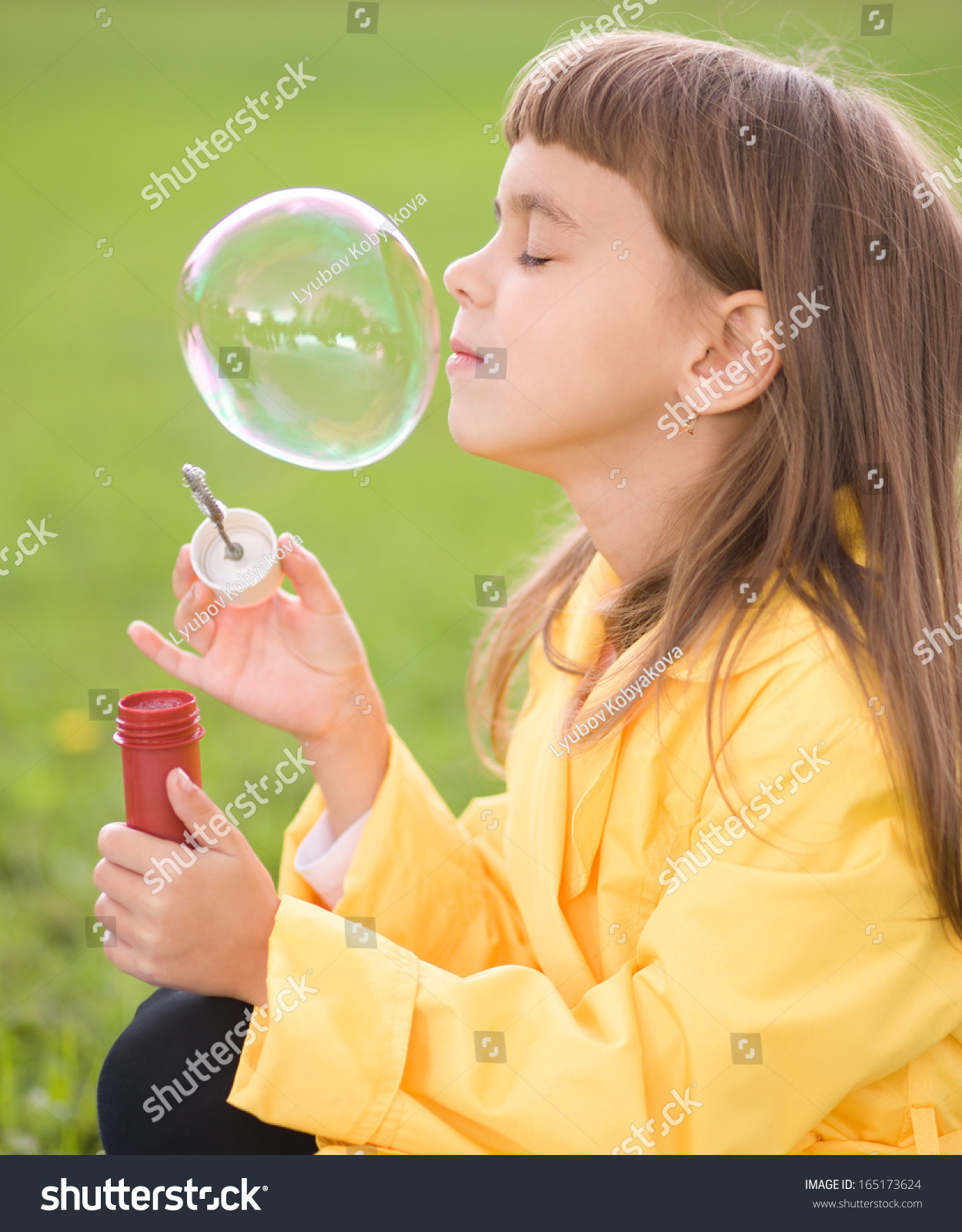 Portrait Of Cute Girl Blowing Soap Bubbles Stock Photo 165173624 ...