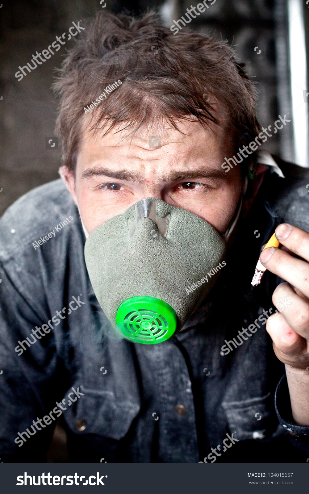Portrait Of Dirty Worker In Gas Mask Smoking Cigarette Stock Photo ...