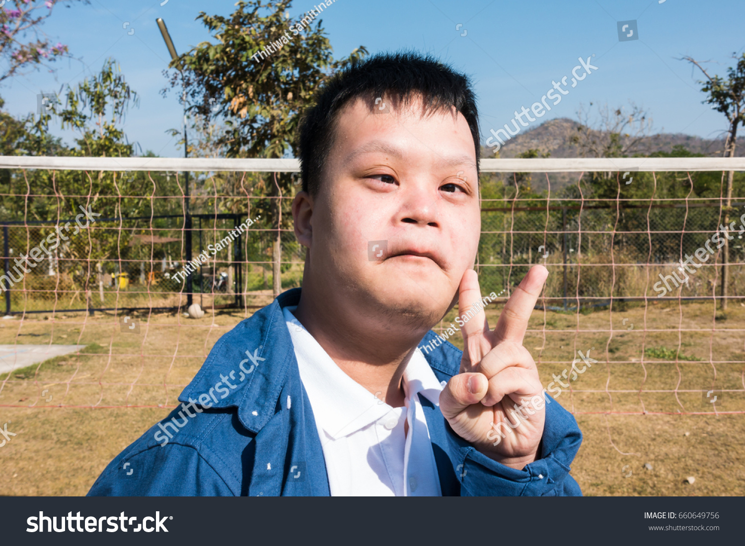 Portrait Happy Down Syndrome Boy Showing Stock Photo (Edit Now) 660649756