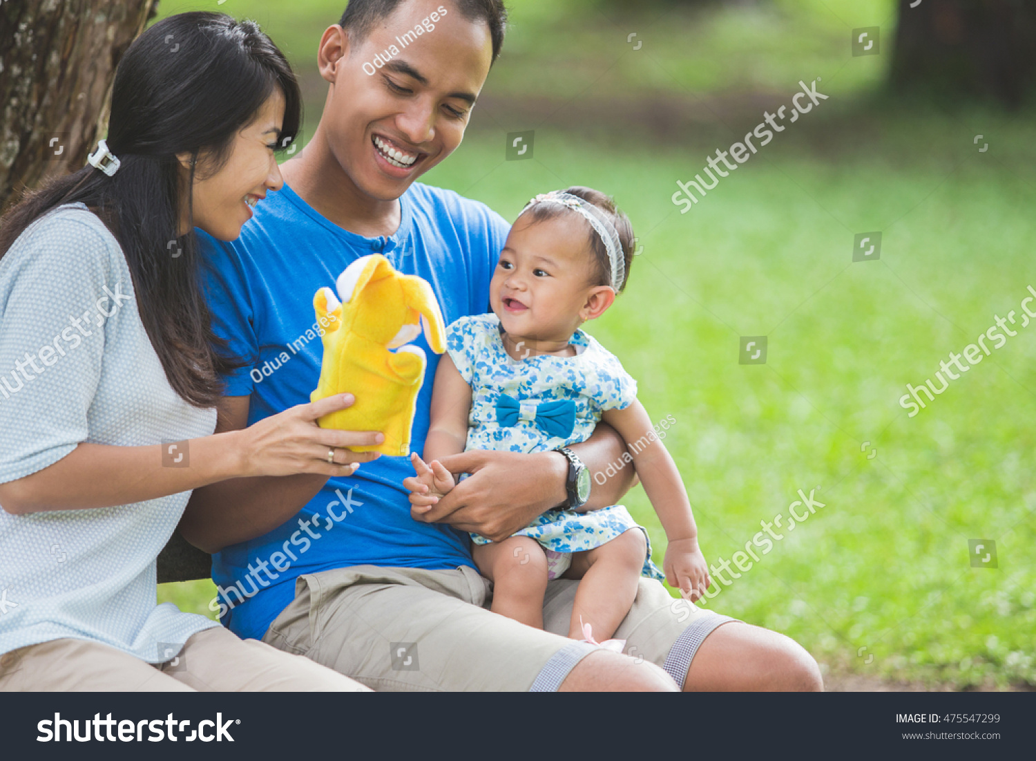 Portrait Happy Family Sitting On Bench Stock Photo Portrait Happy Family Sitting On Bench Stock Photo