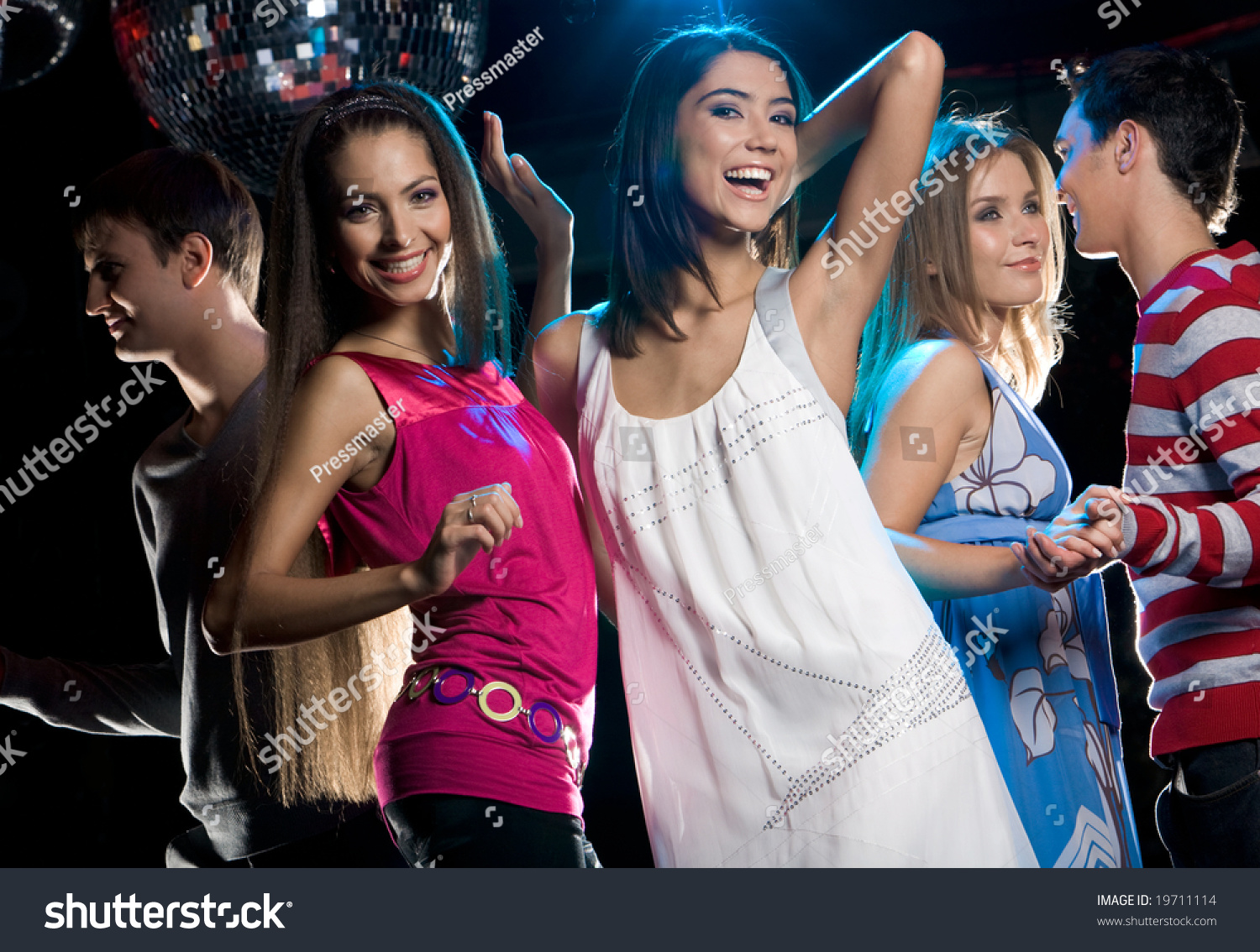 Portrait Of Joyful Girls Laughing While Dancing At Disco With Their ...