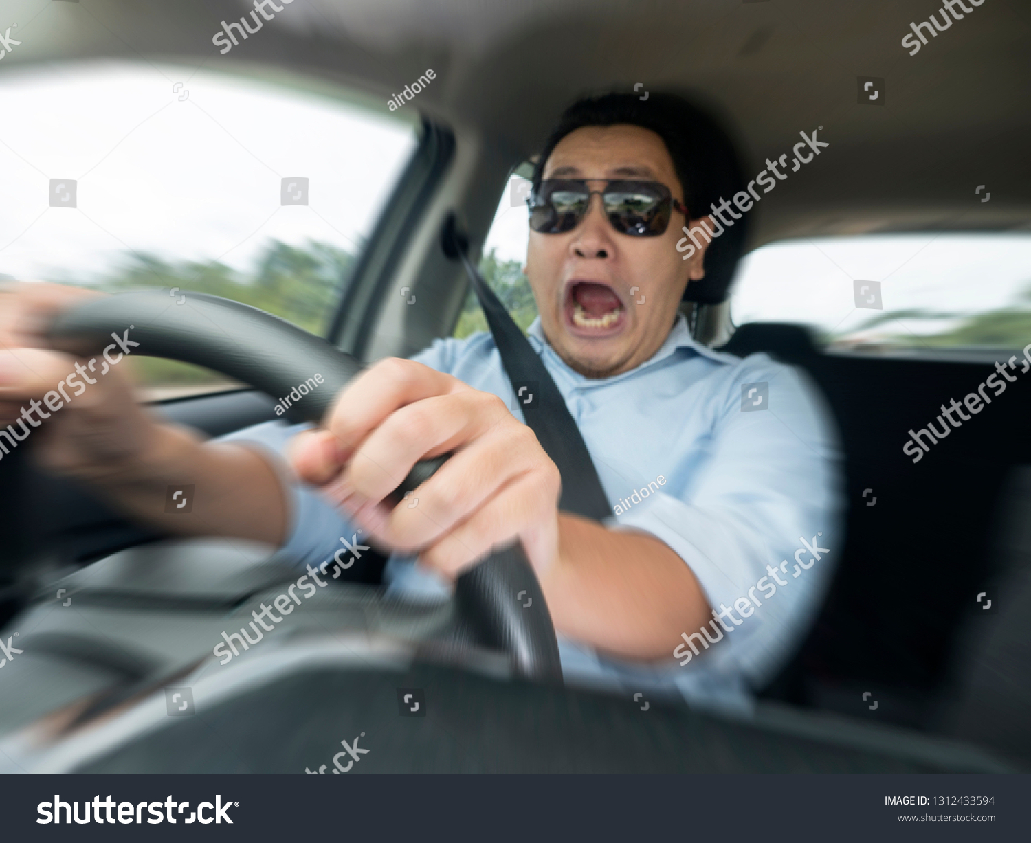 https://image.shutterstock.com/z/stock-photo-portrait-of-male-asian-driver-shocked-and-panic-about-to-have-crash-accident-zoomed-motion-blur-1312433594.jpg