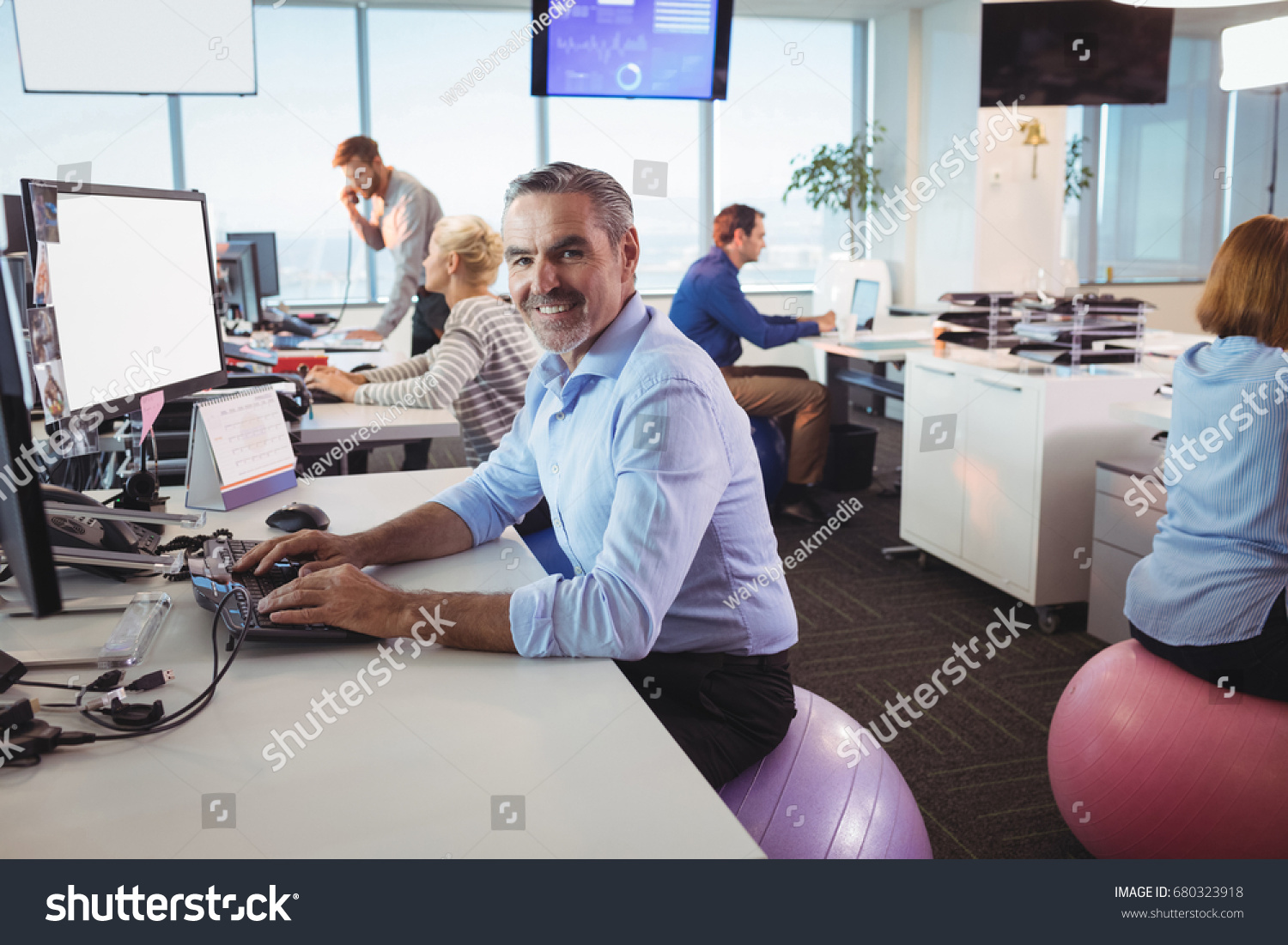 Portrait Smiling Businessman Working Desk While Stock Photo Edit