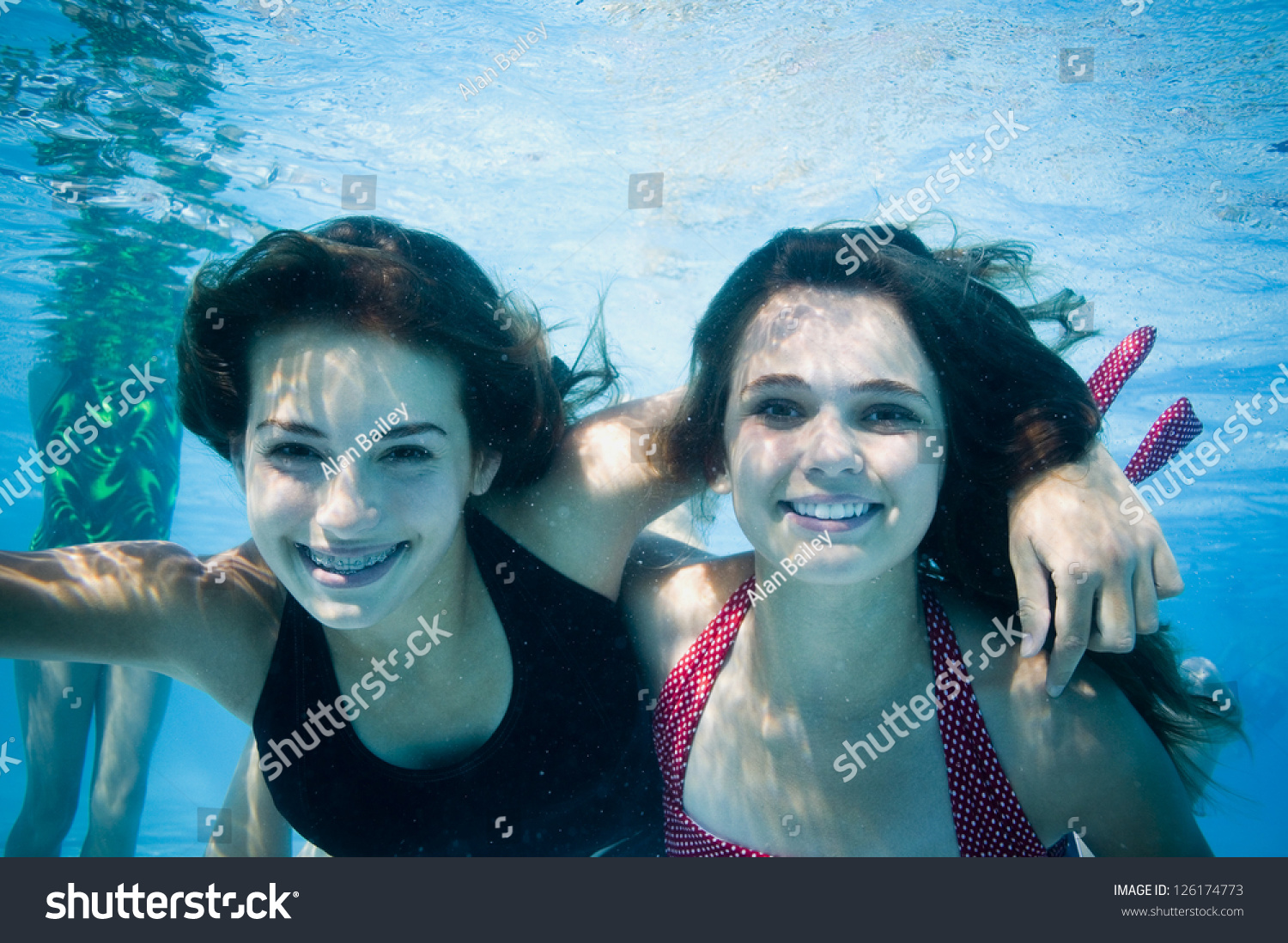 Portrait Of Two Girls Swimming Underwater Stock Photo 126174773 ...