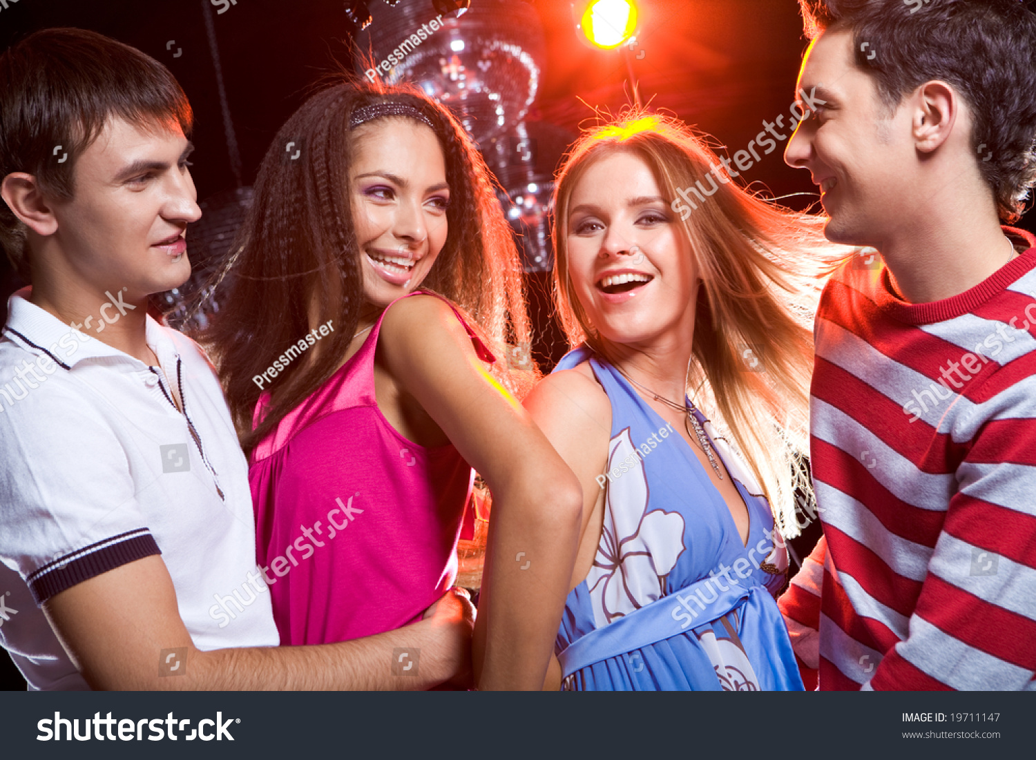 Portrait Of Two Loving Couples Dancing At Disco Together Stock Photo ...