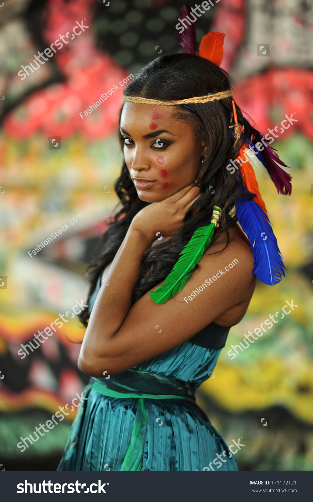 Portrait Of Young Beautiful Indian Cherokee Woman With Feathers In Her