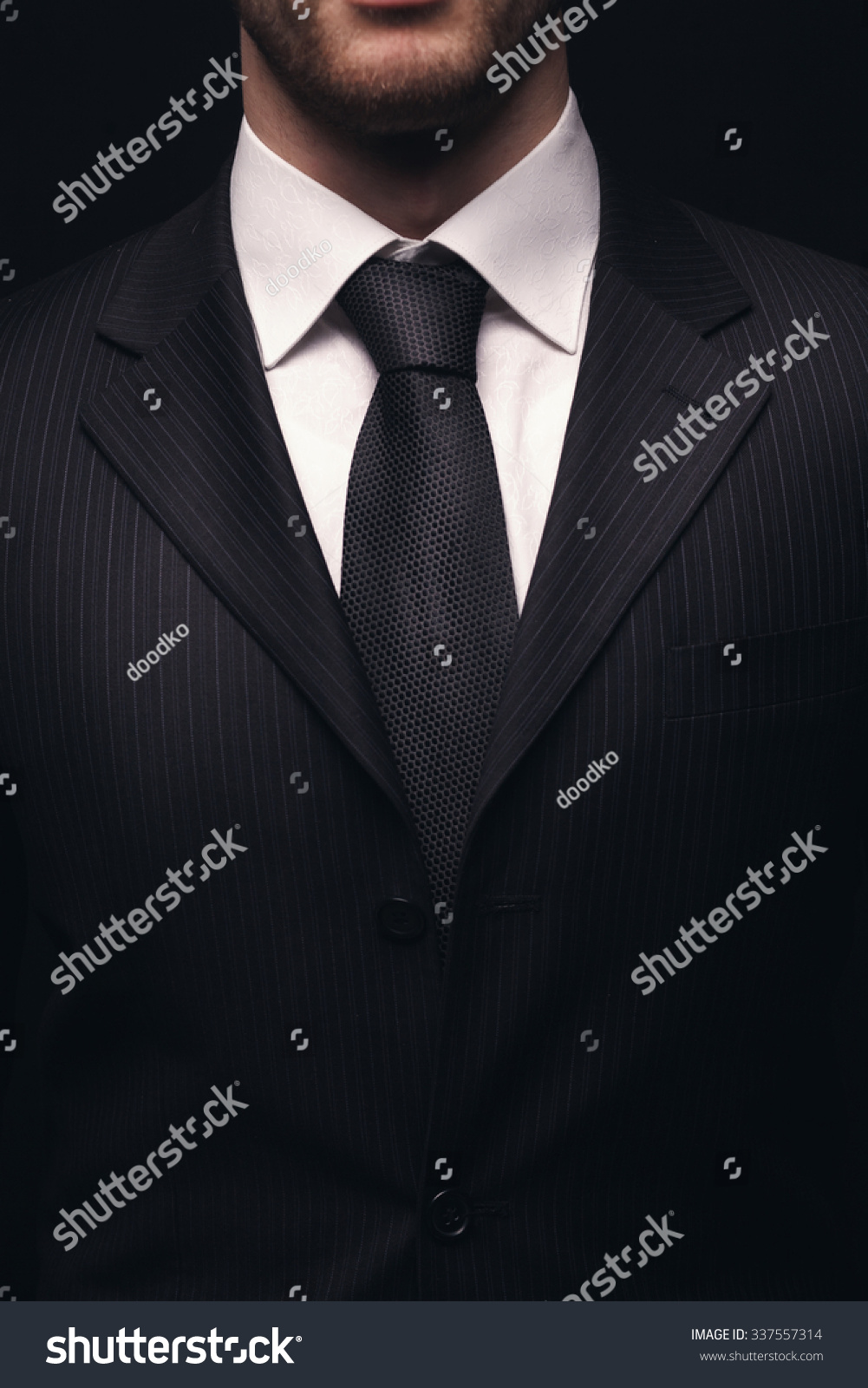 Portrait Of Young Businessmen Suit Isolated On Dark Background Stock ...