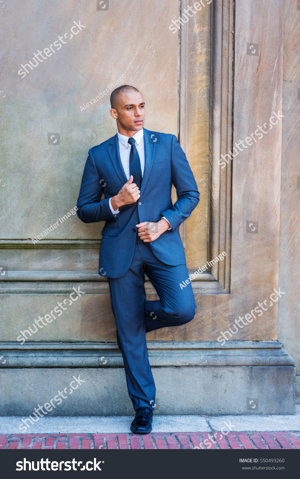 blue suit and white shoes