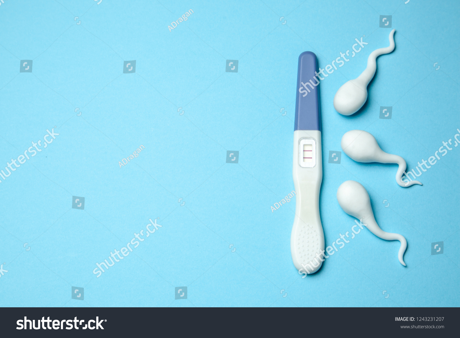 positive-pregnancy-test-two-stripes-sperm-stock-photo-1243231207